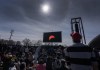 People watch the total solar eclipse at Parc Jean Drapeau, in Montreal, Monday, April 8, 2024. THE CANADIAN PRESS/Ryan Remiorz