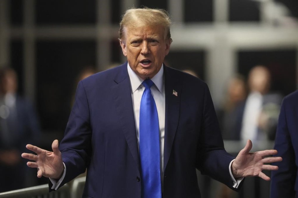 Republican presidential candidate and former U.S. President Donald Trump gestures, as his trial is held at Manhattan state court in New York, Monday, April 22, 2024. on Monday, April 22, 2024. Opening statements in Trump's historic hush money trial began Monday. Trump is accused of falsifying internal business records as part of an alleged scheme to bury stories he thought might hurt his presidential campaign in 2016. (Brendan McDermid/Pool Photo via AP)