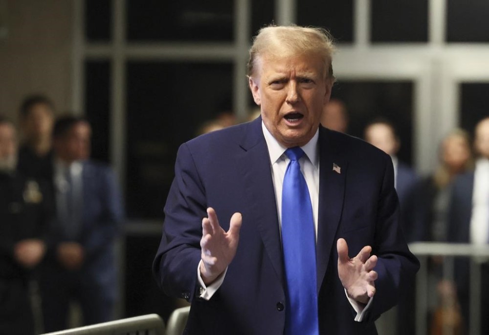 Republican presidential candidate and former President Donald Trump speaks outside the Manhattan Criminal Court in his trial for allegedly covering up hush money payments linked to extramarital affairs in New York on Monday, April 22, 2024. (Angela Weiss/Pool Photo via AP)