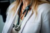 The Canadian Medical Association is asking the federal government to reconsider its proposed changes to capital gains taxation, arguing it will affect doctors' retirement savings. A doctor wears a lab coat and stethoscope in an exam room at a health clinic in Calgary, Alta., Friday, July 14, 2023. THE CANADIAN PRESS/Jeff McIntosh