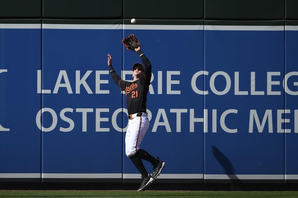 Baltimore Orioles left fielder Austin Hays (21) catches a fly ball hit by Milwaukee Brewers' Willy Adames for an out in the second inning of a baseball game, Saturday, April 13, 2024, in Baltimore. (AP Photo/Nick Wass)