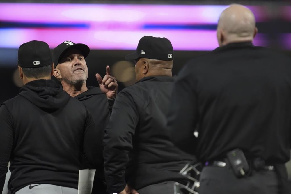 Chicago White Sox manager Pedro Grifol, second from left, points toward home plate umpire Mike Estabrook, right, after being ejected after the top of the eighth inning of a baseball game against the Minnesota Twins, Monday, April 22, 2024, in Minneapolis. (AP Photo/Abbie Parr)