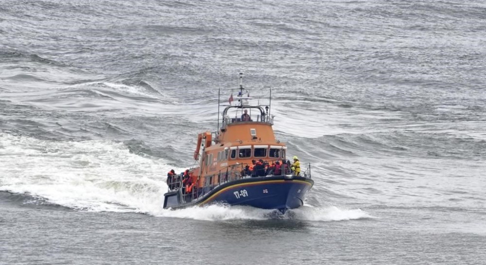 A group of people thought to be migrants are brought in to Dover, Kent, by the Border Force following a small boat incident in the Channel, on Tuesday April 23, 2024. Prime Minister Rishi Sunak said