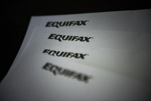 Equifax Canada says it's exploring how rent data could factor in to credit scores to help make credit and financial services accessible to more people. Equifax logos are shown on paper in Toronto on Oct.17, 2019. THE CANADIAN PRESS/Christopher Katsarov