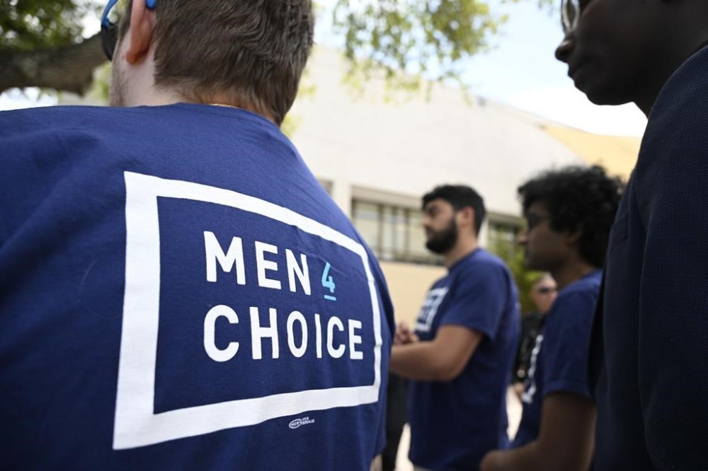 Supporters wear shirts with the message