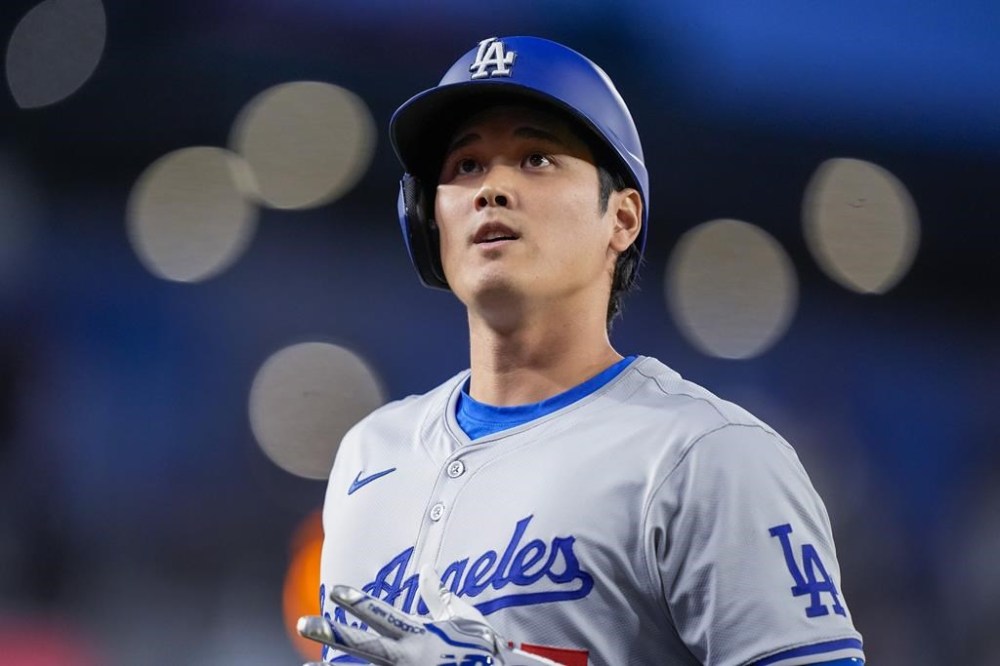 Los Angeles Dodgers designated hitter Shohei Ohtani jogs back to the dugout during the fifth inning of the team's baseball game against the Washington Nationals at Nationals Park, Tuesday, April 23, 2024, in Washington. (AP Photo/Alex Brandon)
