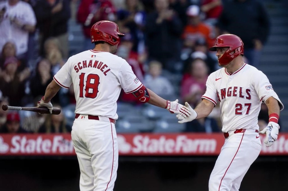 Los Angeles Angels' Mike Trout, right, celebrates his home run during the first inning with Nolan Schanuel during the first inning of a baseball game against the Baltimore Orioles, Tuesday, April 23, 2024, in Anaheim, Calif. (AP Photo/Ryan Sun)