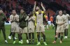 PSG players with Kylian Mbappe, arms in the air, celebrate after the French League One soccer match between Lorient and Paris Saint-Germain at the Moustoir stadium in Lorient, Brittany, western France, Wednesday, April 24, 2024. (AP Photo/Michel Euler)