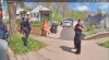 This image made from Fairfield Township, Ohio, Police Department body camera video shows Ann Mayers waiting outside of her home with police on Friday, April 19, 2024, in Hamilton, Ohio. The 74-year-old woman charged in the armed robbery of an Ohio credit union last week is a victim of an online scam who may have been trying to solve her financial problems, according to her relatives. Mayers, who had no previous run-ins with the law, faces counts of aggravated robbery with a firearm and tampering with evidence in Friday's robbery in Fairfield Township. (Fairfield Township Police Department via AP)