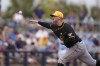 FILE - Pittsburgh Pirates pitcher Paul Skenes throws in the fourth inning of a spring training baseball game against the Tampa Bay Rays in Port Charlotte, Fla., Monday, March 4, 2024. Skenes has a 0.53 ERA through five starts at Triple-A this season, but Pirates general manager Ben Cherington said Wednesday the club is in no rush to call up the top overall pick in the 2023 draft. (AP Photo/Gerald Herbert, File)