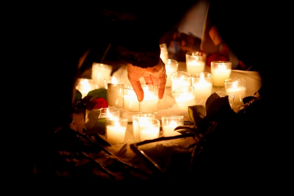 Family and friends of murdered women gather at a vigil in Winnipeg, Thursday, December 1, 2022. Jury selection is set to start today for the trial of a Winnipeg man accused of killing four women. THE CANADIAN PRESS/John Woods