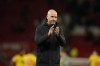 Manchester United's head coach Erik ten Hag waves his supporters at the end of the English Premier League soccer match between Manchester United and Sheffield at the Old Trafford Stadium in Manchester, England, Wednesday, April 24, 2024. (Manchester United won 4-2. AP Photo/Dave Thompson)