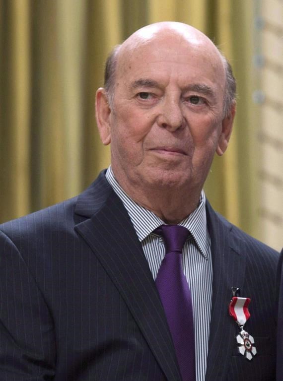 Bob Cole attends an Order of Canada ceremony at Rideau Hall, Friday Sept. 23, 2016 in Ottawa. Broadcaster Cole, a welcome voice for Canadian hockey fans for a half-century, has died at the age of 90. THE CANADIAN PRESS/Adrian Wyld