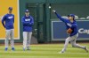Los Angeles Dodgers' Shohei Ohtani throws in the outfield before a baseball game against the Washington Nationals at Nationals Park, Thursday, April 25, 2024, in Washington. (AP Photo/Alex Brandon)