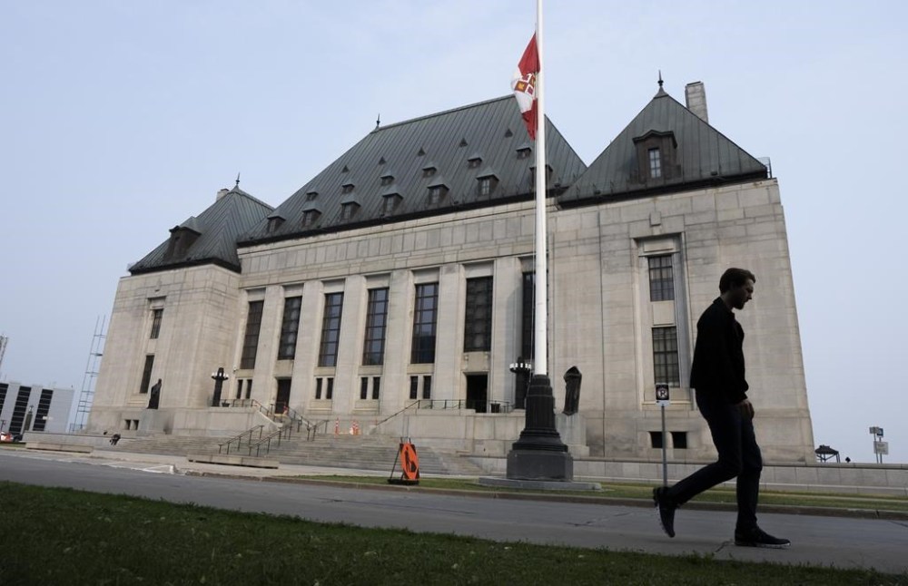 The Supreme Court of Canada has ruled this morning that the constitutional right of judicial independence is not compromised for soldiers appearing in front of military judges. A man walks past the Supreme Court of Canada in Ottawa on Friday, June 16, 2023. THE CANADIAN PRESS/Adrian Wyld