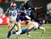Andrew Harris is leaving football as one the greatest running backs in CFL history. Harris (33) hurdles over Winnipeg Blue Bombers defensive back Brandon Alexander (37) as defensive tackle Casey Sayles (90) looks on during the 109th Grey Cup at Mosaic Stadium in Regina, Sunday, Nov. 20, 2022. THE CANADIAN PRESS/Frank Gunn