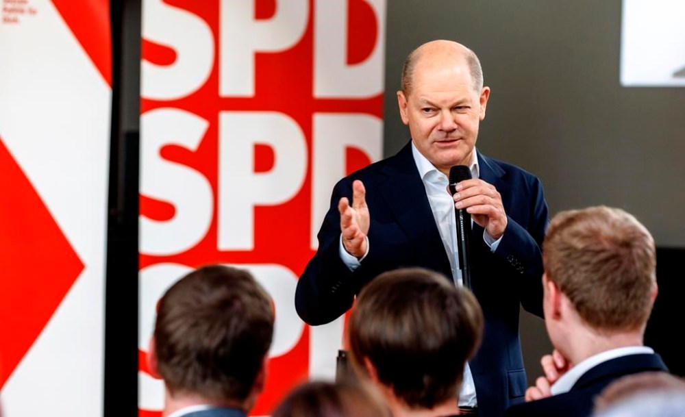 German Chancellor Olaf Scholz speaks at a Citizens' Dialogue organized by the Lüneburg SPD to kick off his party's European election campaign, in Luneburg, Germany, Saturday April 27, 2024. (Markus Scholz/dpa via AP)