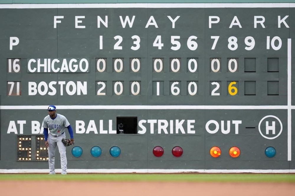 With Chicago Cubs outfielder Patrick Wisdom on the mound, left fielder Alexander Canario waits for the pitch during the eighth inning of a baseball game against the Boston Red Sox, Saturday, April 27, 2024, in Boston. (AP Photo/Michael Dwyer)