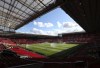 FILE - A general view of the Manchester United's stadium Old Trafford, in Manchester, England, Aug. 10, 2018. A soccer fan has been arrested and charged for alleged tragedy chanting during Manchester United's game against Burnley, Police said Sunday. (AP Photo/Jon Super, File)