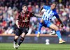 Bournemouth's Marcos Senesi, left, and Brighton and Hove Albion's Joao Pedro , right, challenge for the ball during the English Premier League soccer match between AFC Bournemouth and Brighton & Hove Albion in Bournemouth, England, Sunday, April 28, 2024. (Adam Davy/PA via AP)