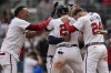 Atlanta Braves' Austin Riley (27) celebrates his walk-off RBI-single for the win in the 10th inning of a baseball game against the Cleveland Guardians, Sunday, April 28, 2024, in Atlanta. (AP Photo/Mike Stewart)