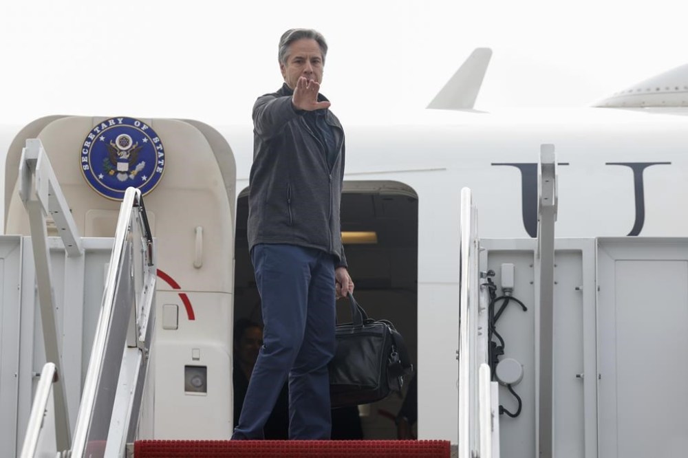 U.S. Secretary of State Antony Blinken gestures as he departs for Saudi Arabia in the latest Gaza diplomacy push, at Joint Base Andrews, Md., Saturday, April 28, 2024. (Evelyn Hockstein/Pool Photo via AP)
