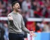 Leverkusen coach Xabi Alonso reacts on the touchline during a German Bundesliga soccer match between Bayer 04 Leverkusen and VfB Stuttgart in Leverkusen, Germany, Saturday, April 27, 2024. (Marius Becker/dpa via AP)