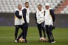 Real Madrid's head coach Carlo Ancelotti, right, waits besides his son, assistant coach Davide Ancelotti, second left, for a training session in Munich, Germany, Monday, April 29, 2024, ahead of the Champions League semi final first leg soccer match between FC Bayern Munich and Real Madrid. (AP Photo/Matthias Schrader)