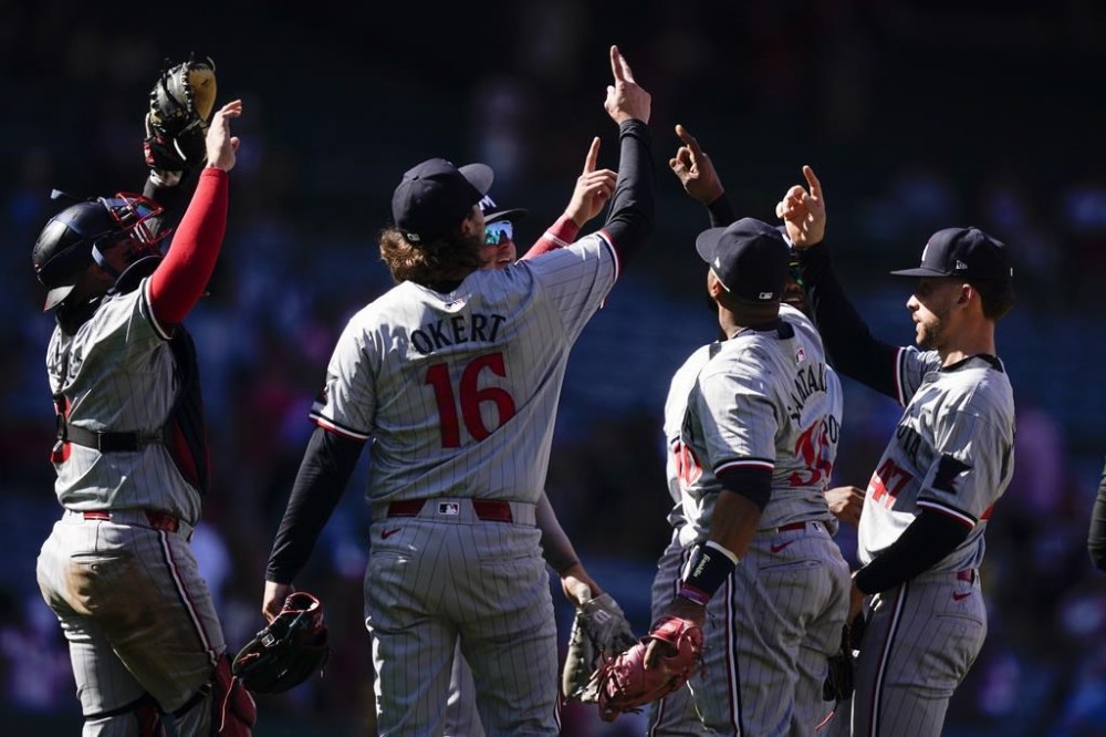 The Minnesota Twins celebrate after their win over the Los Angeles Angels in a baseball game, Sunday, April 28, 2024, in Anaheim, Calif. (AP Photo/Ryan Sun)