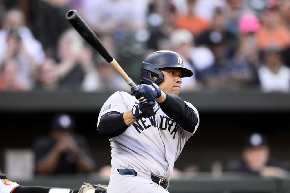 New York Yankees'Juan Soto follows through on a single during the third inning of a baseball game against the Baltimore Orioles, Monday, April 29, 2024, in Baltimore. (AP Photo/Nick Wass)