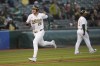 Oakland Athletics' Brent Rooker (25) runs home to score during the fourth inning of a baseball game against the Pittsburgh Pirates in Oakland, Calif., Monday, April 29, 2024. (AP Photo/Jeff Chiu)