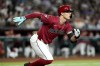 Arizona Diamondbacks' Randal Grichuk runs on his base hit against the Los Angeles Dodgers during the fourth inning of a baseball game, Monday, April 29, 2024, in Phoenix. (AP Photo/Matt York)