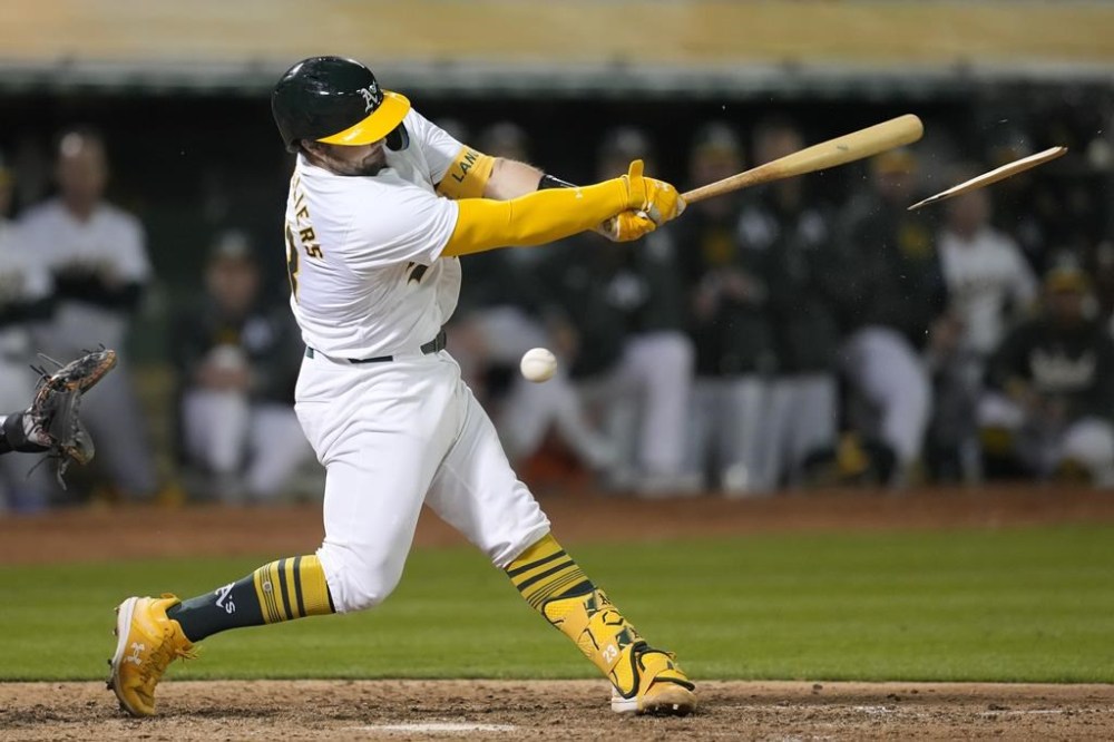 Oakland Athletics' Shea Langeliers breaks his bat while fouling off a pitch during the eighth inning of a baseball game against the Pittsburgh Pirates in Oakland, Calif., Monday, April 29, 2024. (AP Photo/Jeff Chiu)
