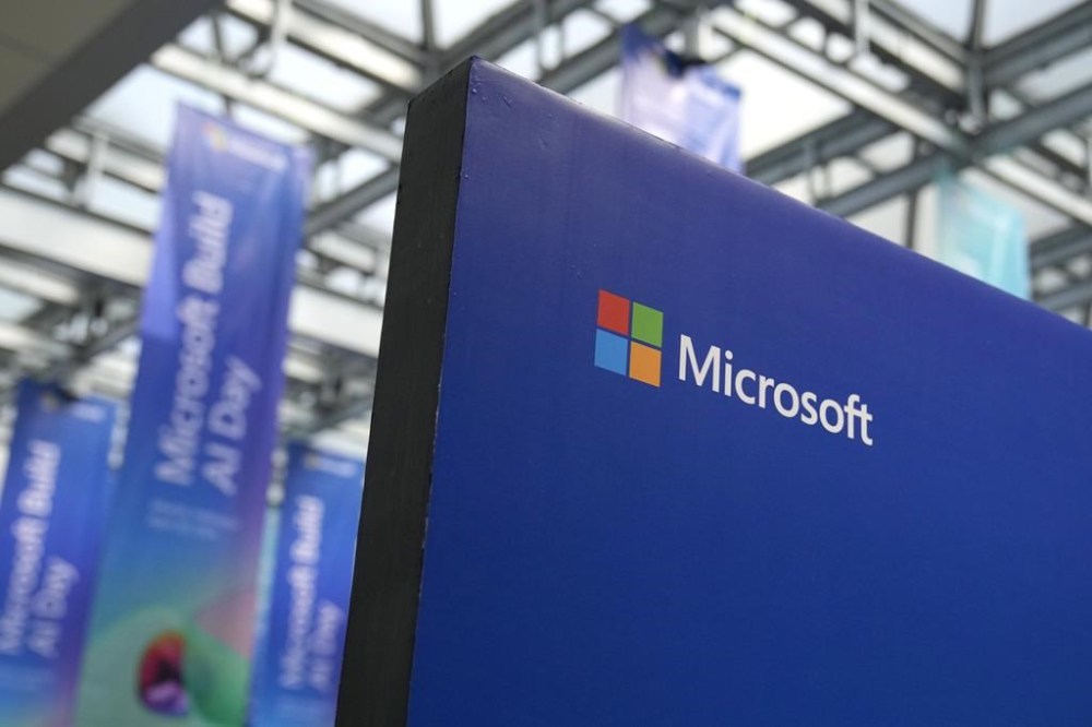 A logo of Microsoft is displayed during an event titled