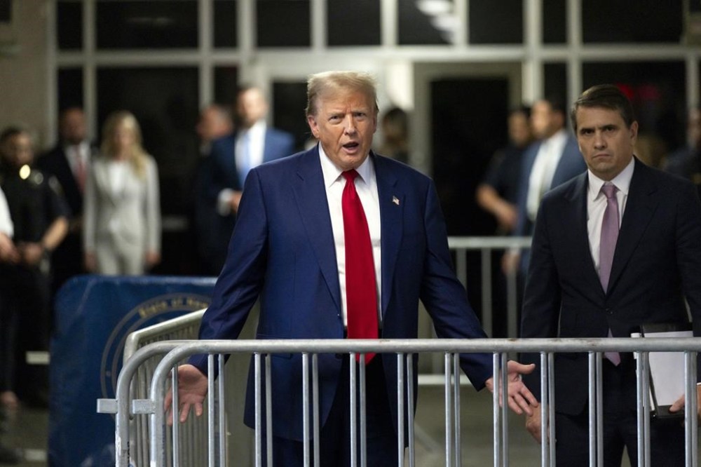 Former President Donald Trump speaks with the media as he leaves the courtroom following the day's proceedings in his trial at Manhattan criminal court in New York, Tuesday, April 30, 2024. (Justin Lane/Pool Photo via AP)