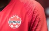 A Canada soccer logo is seen on Alphonso Davies in Vancouver on March 24, 2019. THE CANADIAN PRESS/Darryl Dyck