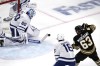 Toronto Maple Leafs goaltender Joseph Woll (60) makes a stick save against Boston Bruins left wing Brad Marchand (63) during the second period of Game 5 of an NHL hockey Stanley Cup first-round playoff series, Tuesday, April 30, 2024, in Boston. (AP Photo/Charles Krupa)