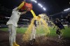 Milwaukee Brewers' Tyler Black is dunked by Willy Adames after a baseball game against the Tampa Bay Rays Tuesday, April 30, 2024, in Milwaukee. (AP Photo/Aaron Gash)