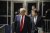 Former President Donald Trump walks outside the courtroom of his trial at Manhattan criminal court, Tuesday, April 30, 2024, in New York. His attorney, Todd Blanche, is on the right. (Curtis Means/Pool Photo via AP)