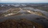 Peguis First Nation is shown surrounded with Fisher River floodwater north of Winnipeg, Sunday, May 15, 2022. A Manitoba First Nation has declared a state of emergency in response to a health crisis caused by repeated flooding. THE CANADIAN PRESS/John Woods