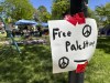 Posters surround an encampment established by University of New Mexico students and supporters who are protesting the Israel-Hamas war, on the main campus in Albuquerque, N,M., on Wednesday, May 1, 2024. (AP Photo/Susan Montoya Bryan)