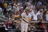 San Diego Padres' Jake Cronenworth celebrates after hitting a grand slam during the seventh inning of a baseball game against the Cincinnati Reds, Wednesday, May 1, 2024, in San Diego. (AP Photo/Gregory Bull)