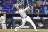 Miami Marlins Dane Myers hits a single to bring in two runs during the eighth inning of a baseball game against the Colorado Rockies, Wednesday, May 1, 2024, in Miami. (AP Photo/Marta Lavandier)