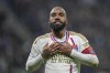 Lyon's Alexandre Lacazette celebrates after his team scored their third gaol during a French League One soccer match between Lyon and Monaco at the Groupama stadium in Decines, outside Lyon, France, Sunday, April 28, 2024. (AP Photo/Laurent Cipriani)