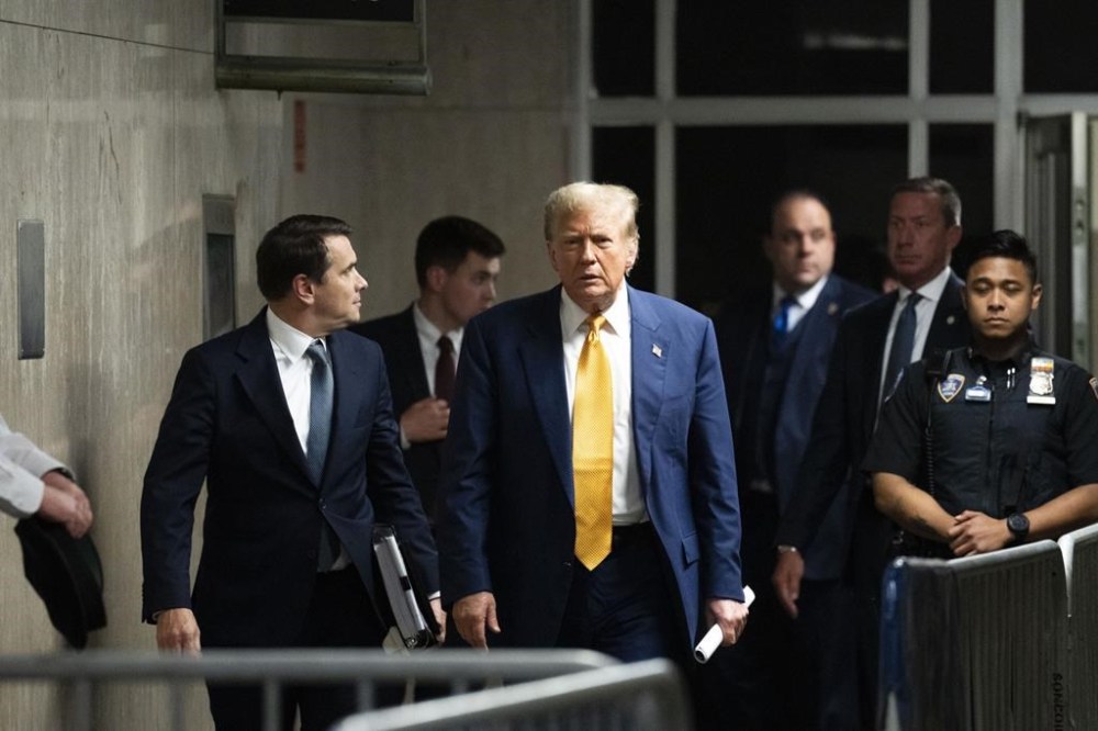 Republican presidential candidate, former President Donald Trump walks to reporters to make a statement at the end of the day of his trial at the Manhattan criminal court, Thursday, May, 2, 2024, in New York. (Doug Mills/The New York Times via AP, Pool)