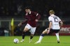 Torino's Raoul Bellanova, left, and Bologna's Victor Kristiansen battle for the ball during the Serie A soccer match between Torino and Bologna at the Olympic Stadium Grande Torino, Turin, Italy, Friday May 3, 2024. (Spada/LaPresse via AP)