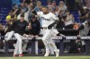 Miami Marlins' Luis Arraez scores the winning run on a hit by Jesús Sánchez during the 10 inning of a baseball game against the Colorado Rockies, Thursday, May 2, 2024, in Miami. The Marlins defeated the Rockies 5-4. (AP Photo/Marta Lavandier)