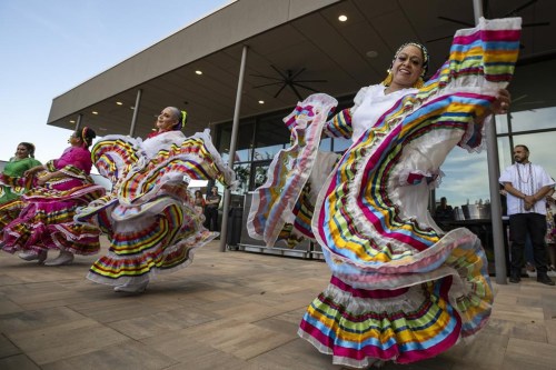 FILE - Folklorico dancers from the group Viva Mexico perform their routine during a Cinco de Mayo celebration and mixer hosted by the Odessa Hispanic Chamber of Commerce at the Odessa Marriott Hotel and Convention Center, Wednesday, May 5, 2021, in Odessa, Texas. The United States is gearing up for Cinco de Mayo. Music, all-day happy hours and deals on tacos are planned at venues across the country on May 5, 2024 in a celebration with widely misunderstood origins that is barely recognized south of the border. (Eli Hartman/Odessa American via AP, File)