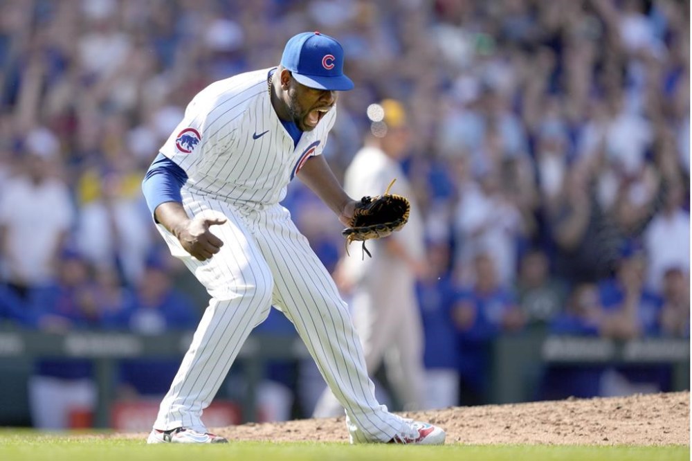 Chicago Cubs relief pitcher Héctor Neris celebrates after the last out of the team's 6-5 win over the Milwaukee Brewers in a baseball game Saturday, May 4, 2024, in Chicago. (AP Photo/Charles Rex Arbogast)