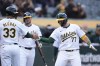 Oakland Athletics' Brett Harris (77) celebrates with JJ Bleday (33) after hitting a two-run home run against the Miami Marlins during the sixth inning of a baseball game Saturday, May 4, 2024, in Oakland, Calif. (AP Photo/Godofredo A. Vásquez)